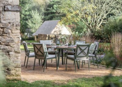 Bramblecrest Wisley 175x120cm Elliptical Table with 6 Armchairs, Parasol & Base - Sage