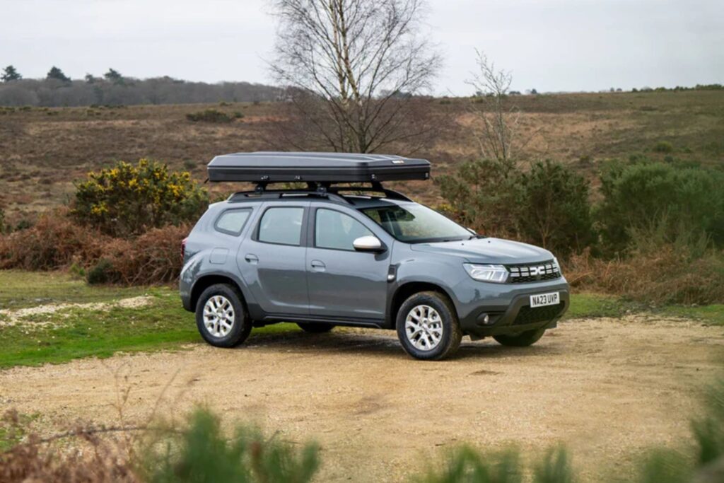 Car with folded TentBox on roof.